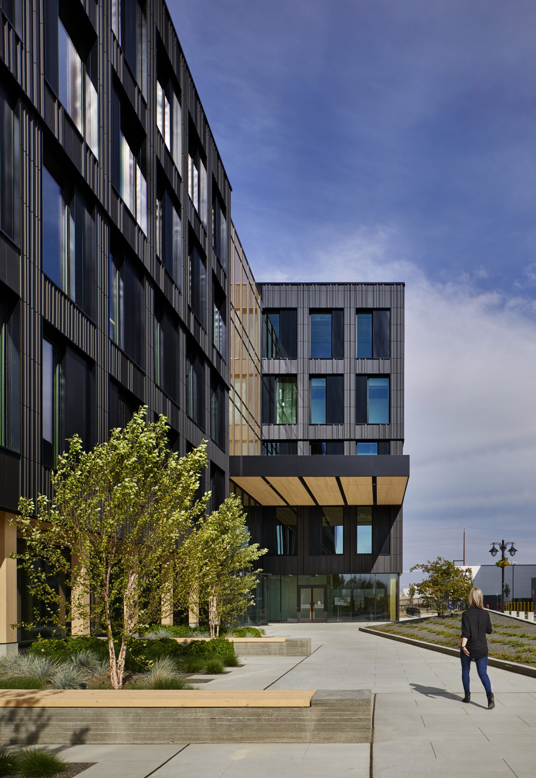 An outdoor photograph of a multi level building with modern design.